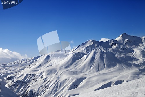 Image of View on ski slope and beautiful mountains at sunny day