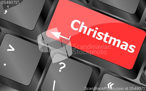 Image of christmas button on the keyboard key - holiday concept