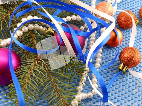 Image of holiday concept: gifts, pearls, tree branch and christmas ball