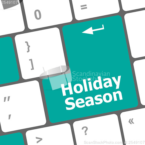 Image of holiday season button on modern internet computer keyboard key