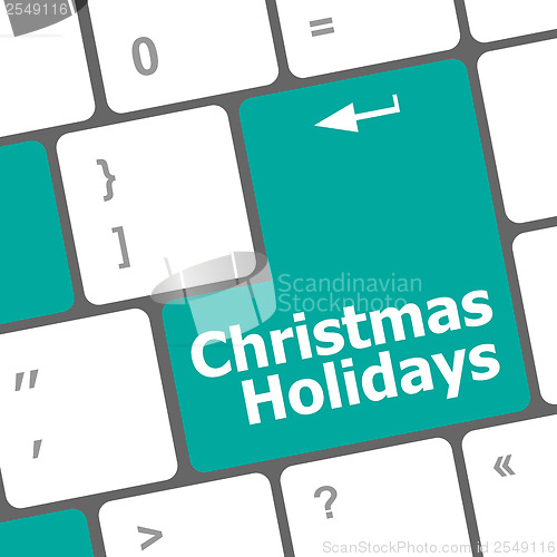 Image of Computer keyboard key with christmas holidays words