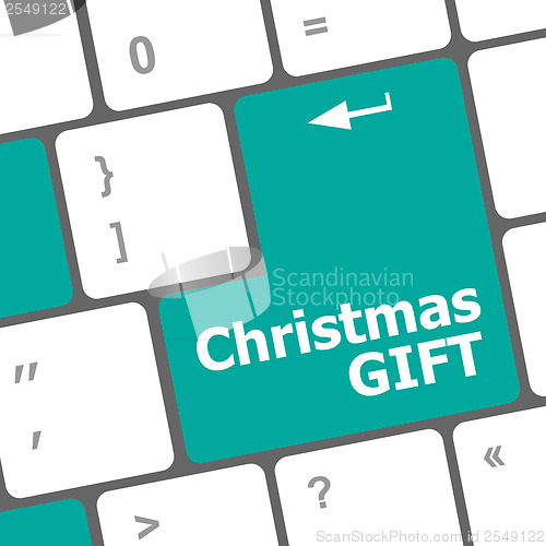 Image of Computer keyboard key with christmas gift words