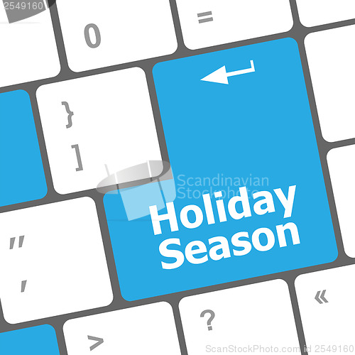 Image of holiday season button on modern internet computer keyboard key