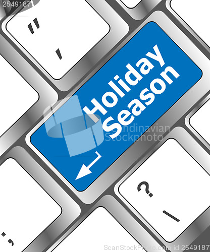 Image of holiday season button on modern internet computer keyboard key