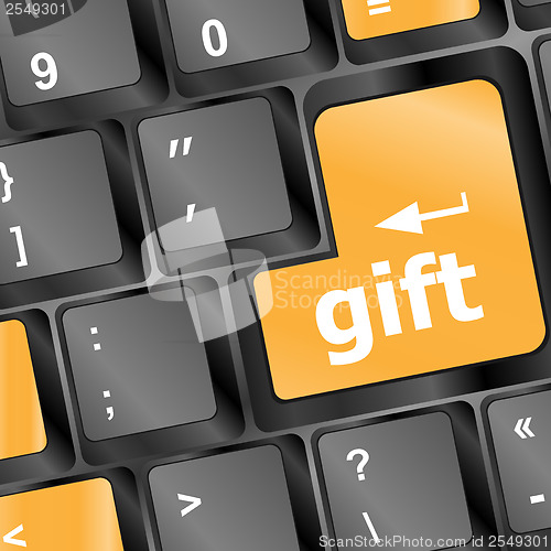 Image of Computer keyboard with gift key - business background
