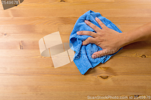 Image of Man cleaning table