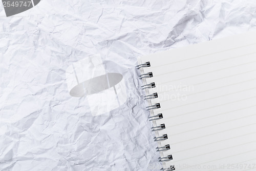 Image of White crumple paper and notepad