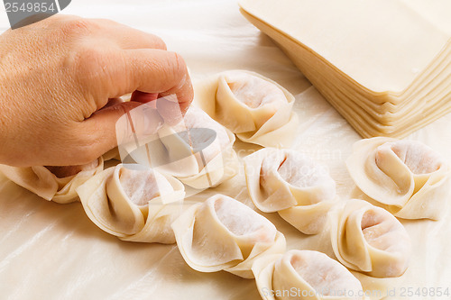 Image of Wrapping chinese dumpling