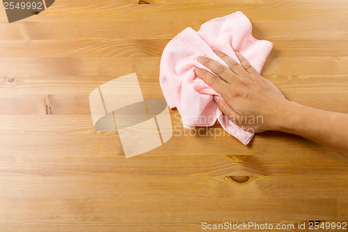 Image of Cleaning table by towel