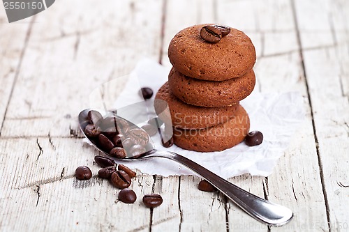 Image of chocolate cookies and spoon with coffee beans 