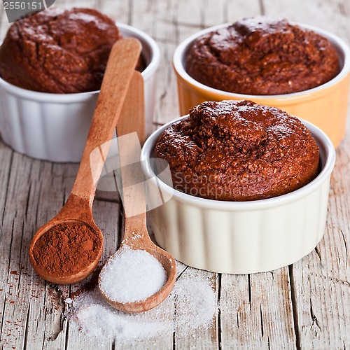 Image of fresh baked browny cakes, sugar and cocoa powder 