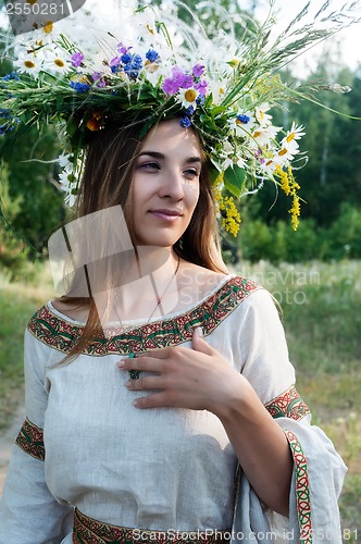 Image of Beautiful woman with flower wreath