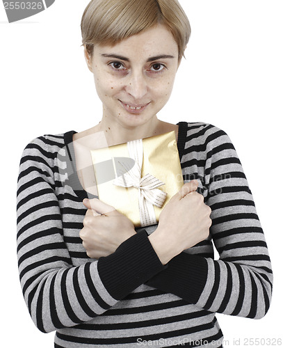 Image of Young woman holding a present