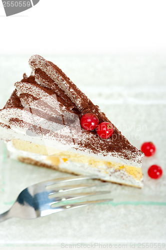 Image of whipped cream and ribes dessert cake slice