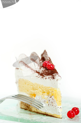 Image of whipped cream and ribes dessert cake slice