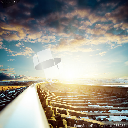 Image of railroad close up to sunset