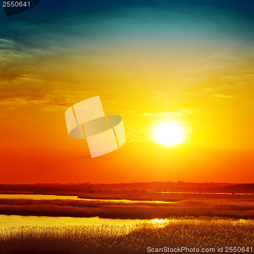 Image of golden sunset over river