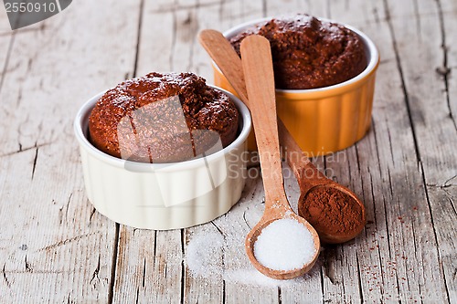 Image of fresh baked browny cakes, sugar and cocoa powder 