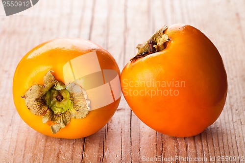 Image of two fresh persimmons