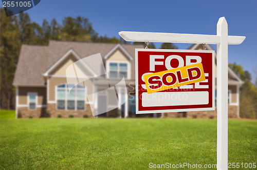 Image of Sold Home For Sale Sign in Front of New House