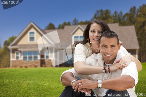 Image of Happy Hispanic Young Couple in Front of Their New Home