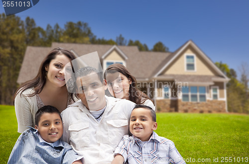 Image of Young Hispanic Family in Front of Their New Home