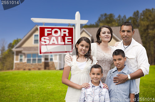 Image of Hispanic Family, New Home and For Sale Real Estate Sign