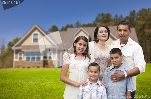 Image of Young Hispanic Family in Front of Their New Home