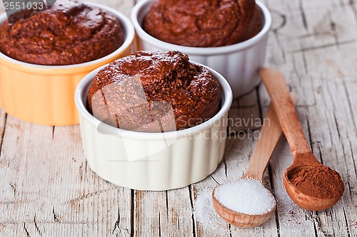 Image of fresh baked browny cakes, sugar and cocoa powder