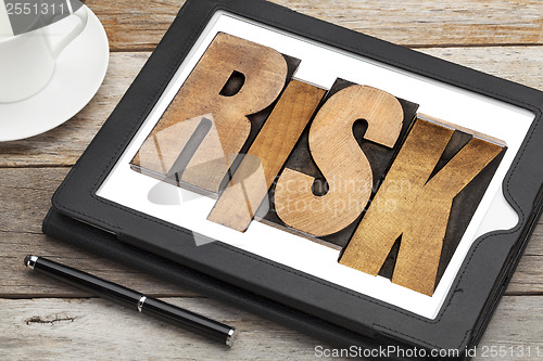 Image of risk - word on digital tablet