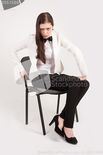 Image of Angry business woman on chair