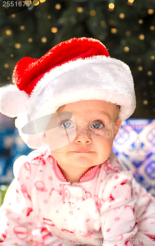 Image of Adorable female toddler in Christmas clothes