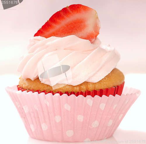 Image of Vanilla cupcake with stawberry frosting and strawberriy