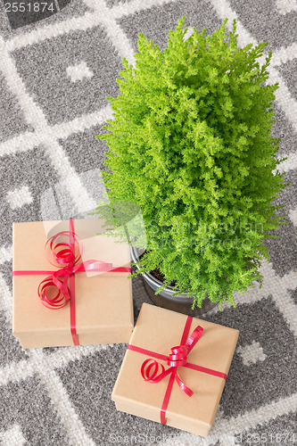 Image of Presents near little Christmas tree