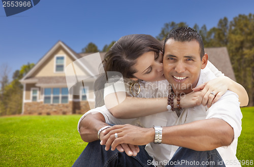 Image of Happy Hispanic Young Couple in Front of Their New Home