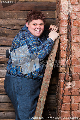 Image of Happy overweight young man