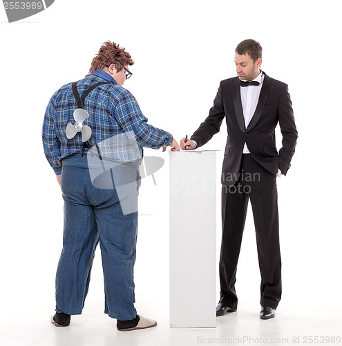 Image of Elegant man arguing with a country yokel
