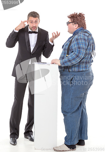 Image of Elegant man arguing with a country yokel