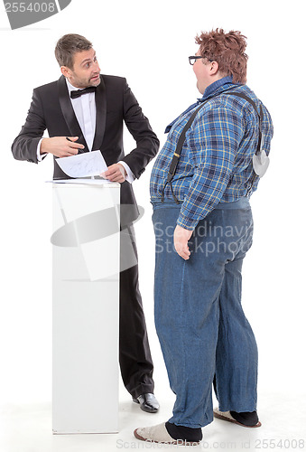 Image of Elegant man arguing with a country yokel