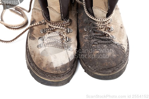 Image of Old dirty trekking boots isolated on white background