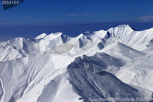 Image of View on off-piste snowy slopes at nice sunny day