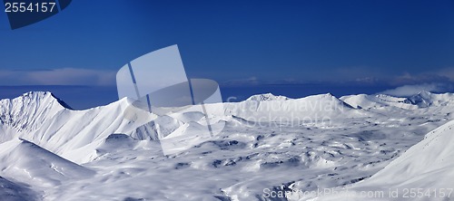 Image of Panoramic view on snowy plateau and blue sky at nice day