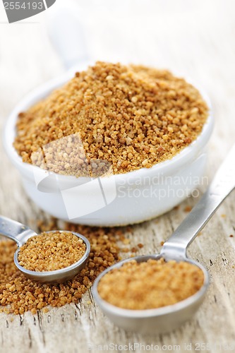 Image of Coconut palm sugar in measuring spoons