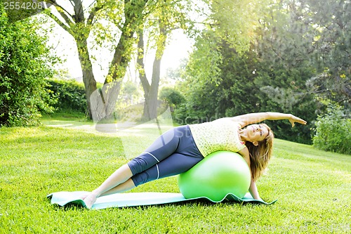 Image of Woman on yoga balance ball