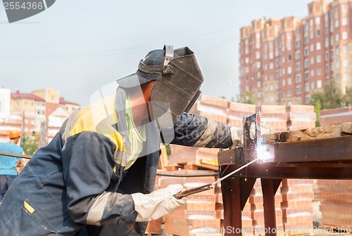 Image of industrial worker welder during working process