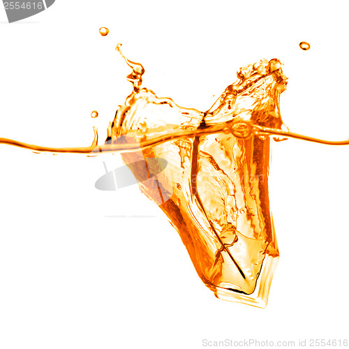 Image of ice cubes dropped into orange water with splash isolated on whit