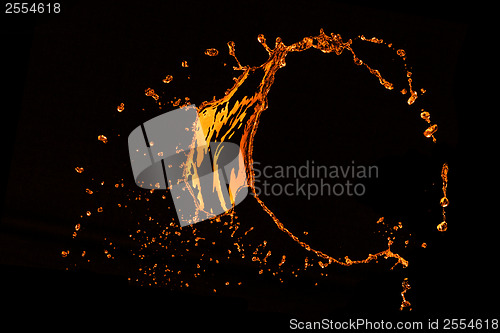 Image of orange water splash isolated on black