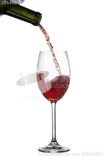 Image of Red wine pouring into glass with splash isolated on white