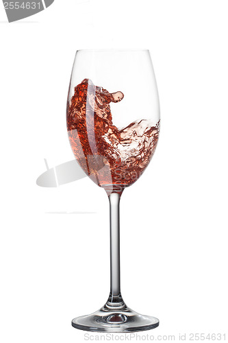 Image of Red wine pouring into glass with splash isolated on white