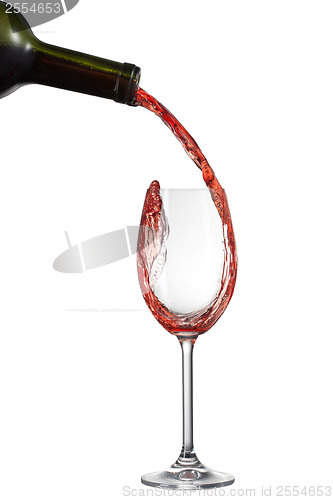 Image of Red wine pouring into glass with splash isolated on white